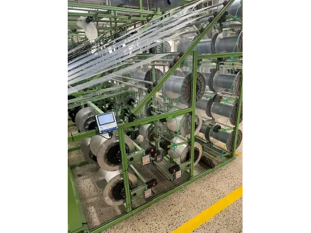 Contrôle actif integré de la tension de la chaîne du cantre d’ourdissage