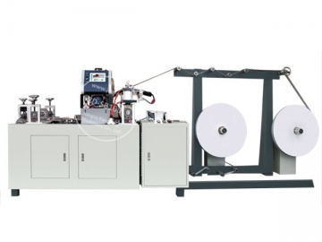 Machine pour la transformation du papier <small>(pour fabrication d'anses de sacs en papier)</small>
