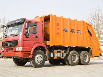 Camion compacteur de déchets